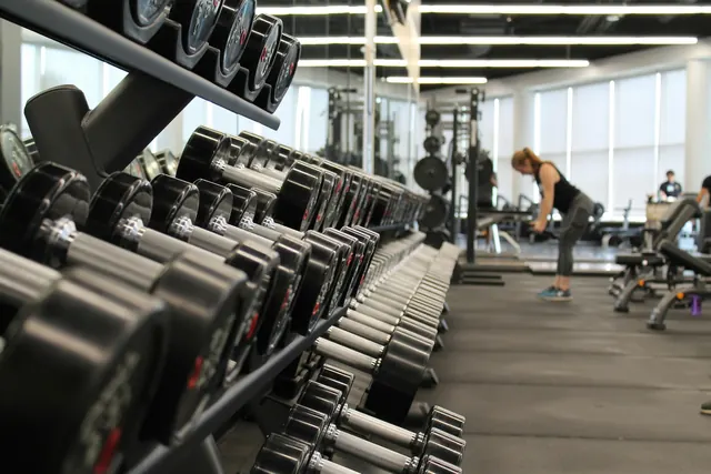 The fitness room, with racks of dumbbells and training machines