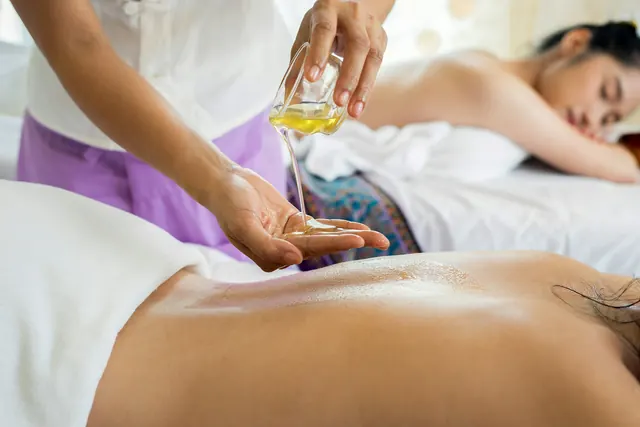 A guest relaxing during a massage treatment in the spa