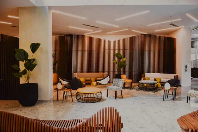 The lobby, with timber slat walls and low lounge seating
